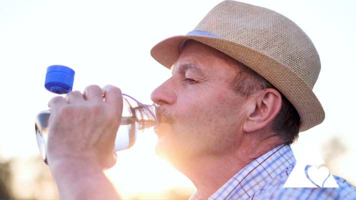Elder man drinking water